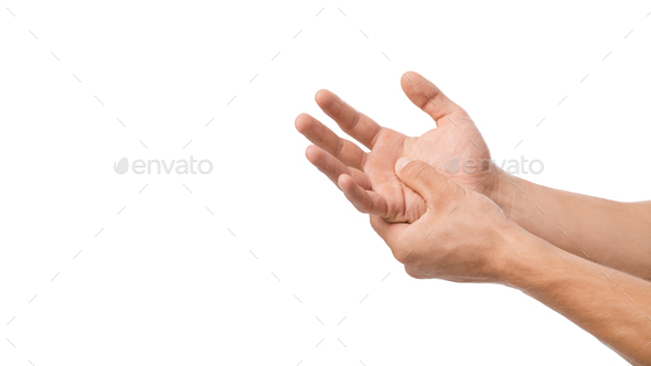 Unrecognizable millennial caucasian male presses his hand to sore spot and suffers from pain in arm