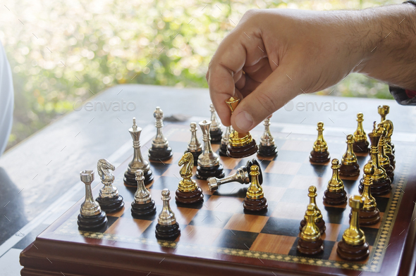 queen take a checkmate on chess board game. concept of business