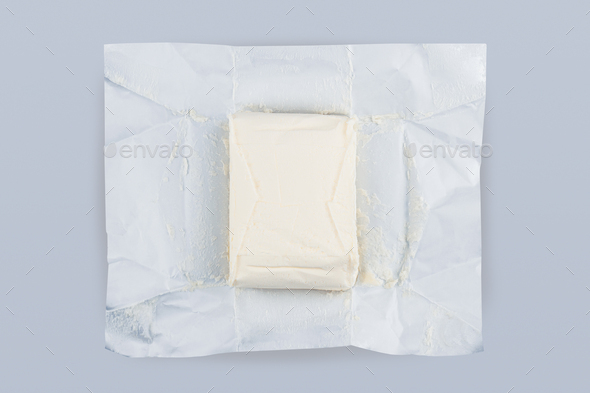 unpacked butter on grey background - Stock Photo - Images