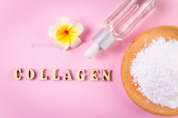 Natural bio supplement collagen powder. Moisturizing cosmetic serum on a pink background.