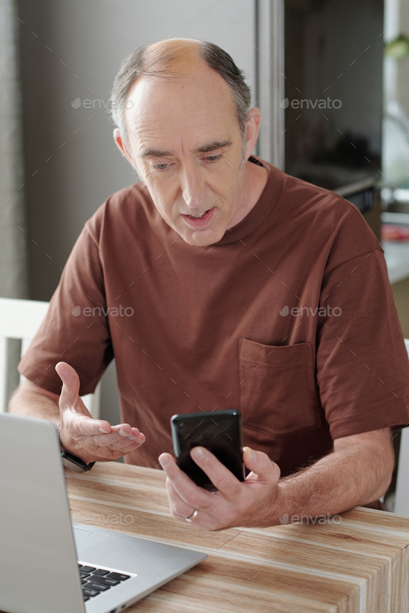 Senior Man Using Mobile Application