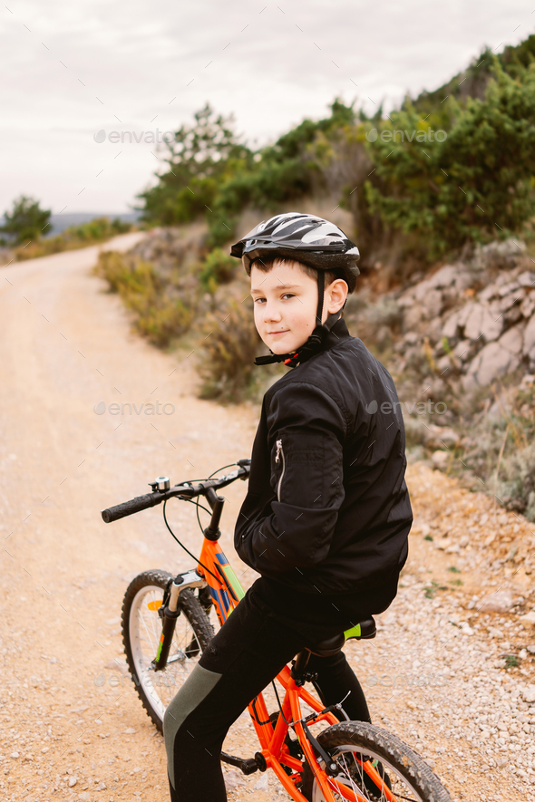 Boy on a bicycle - Stock Photo - Images