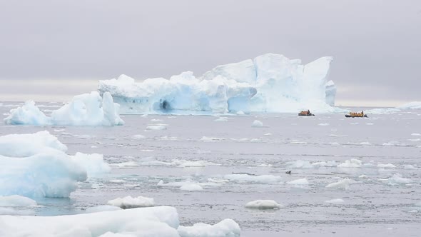 A Group of Tourists in a Zodiac Crusing in the Ice