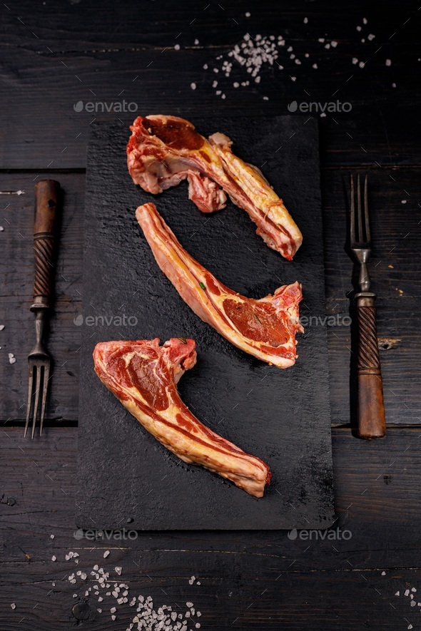 Fresh raw lamb ribs. Halal meat. Raw meat. Lamb rack on a dark rustic background