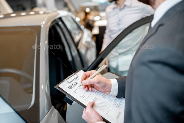 Filling car rental documents - Stock Photo - Images