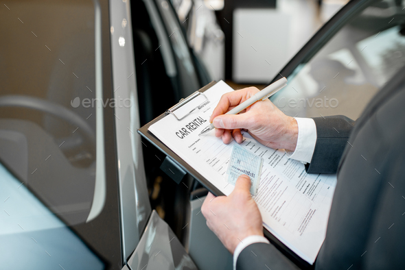 Filling car rental documents - Stock Photo - Images