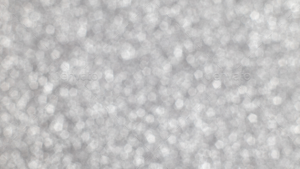 Silver festive Christmas background. Abstract shimmering background with bokeh silver lights