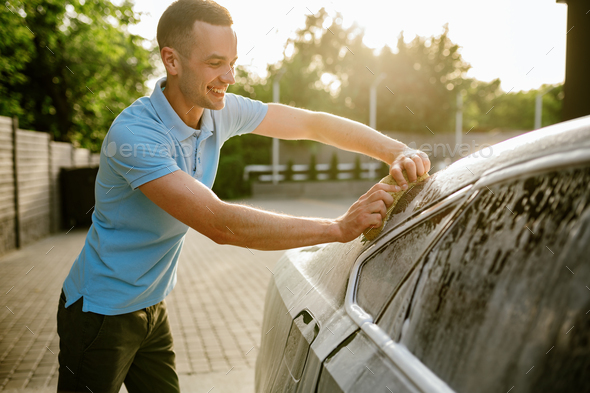 Cleaning The Car With Foam,car Wash Shop Stock Photo, Picture and