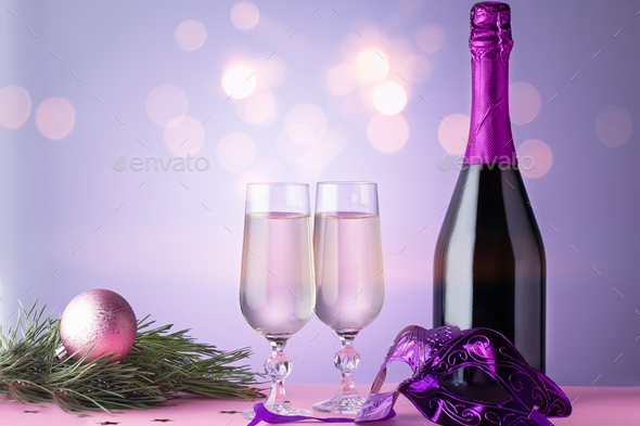 Christmas card with two glasses of champagne, bottle, carnival mask
