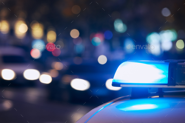 Blue flasher light of siren of police car