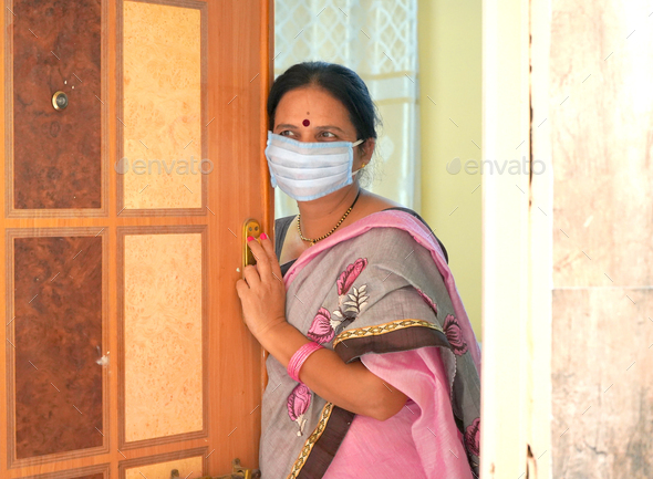 Woman wearing medical protective masks - Stock Photo - Images