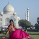 Young girl tourist in front of Taj Mahal in Agra, India . concept of culture, tourism. - PhotoDune Item for Sale