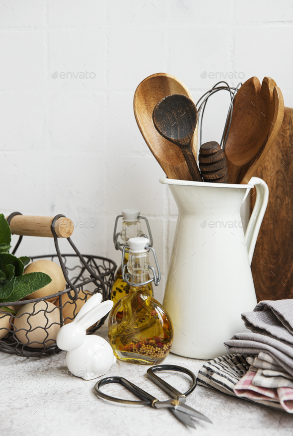 Kitchen utensils, tools and dishware on on the background white tile