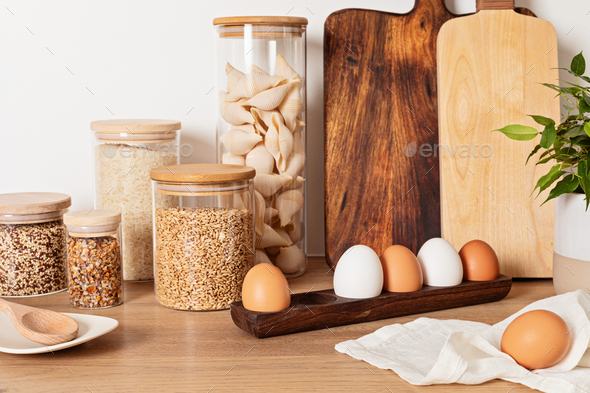 Organizing zero waste storage in kitchen. Pasta and cereals in reusable  glass containers in kitchen Stock Photo by OksaLy