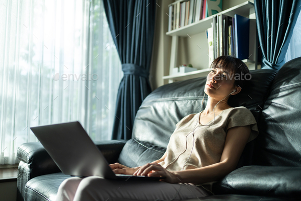 Asian busy businesswoman lean on sofa to get rest and break for health. - Stock Photo - Images
