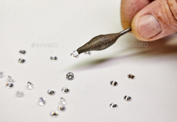 Jewelry production. Special wax setter diamonds on a white background
