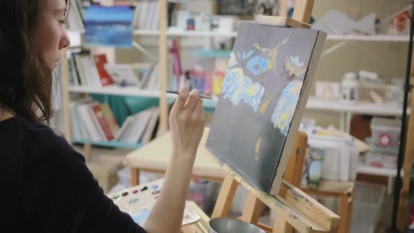 Adult Female Painter Is Drawing Abstract Picture in Her Creative Studio alt