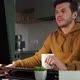 Man Works at Home Office Remotely Using Computer - VideoHive Item for Sale