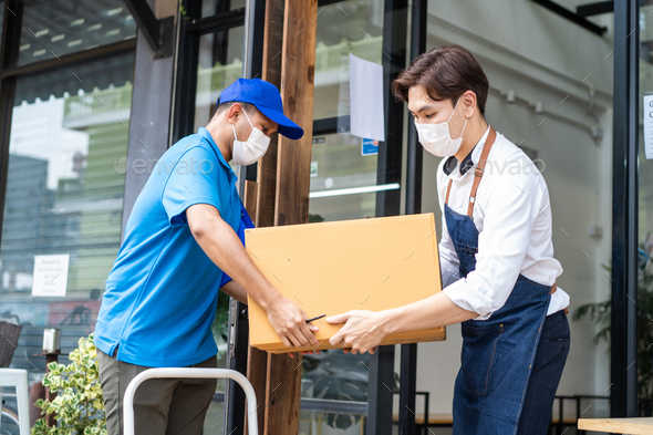 Asian Postman delivery send food ingredients box deliver to restaurant waiter in coffeehouse