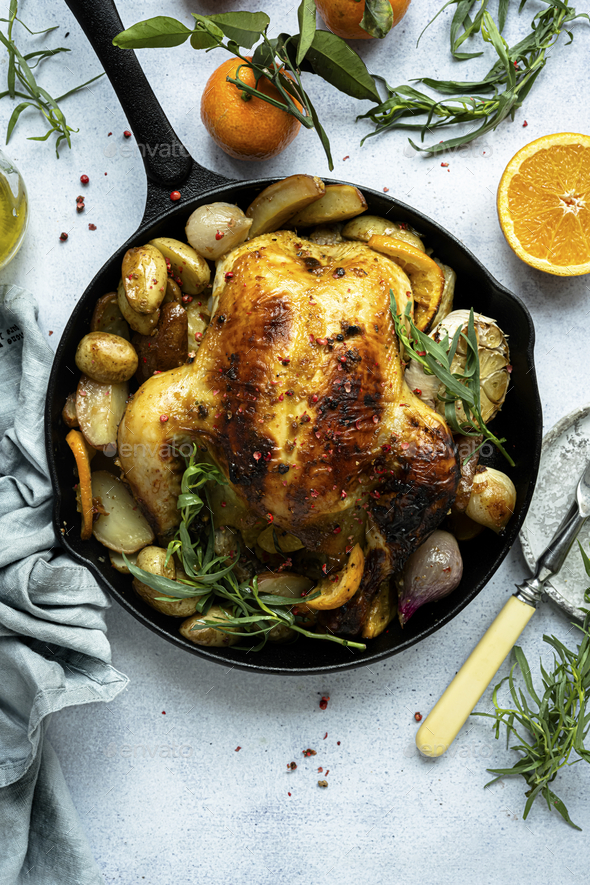 Holiday dinner with roasted chicken and potatoes food photography - Stock Photo - Images