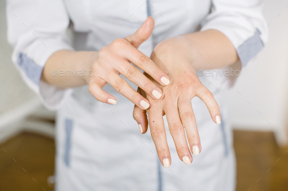 Close up of woman\'s hands in body scrub. Grained hand peeling. Wellness and spa scrub hands