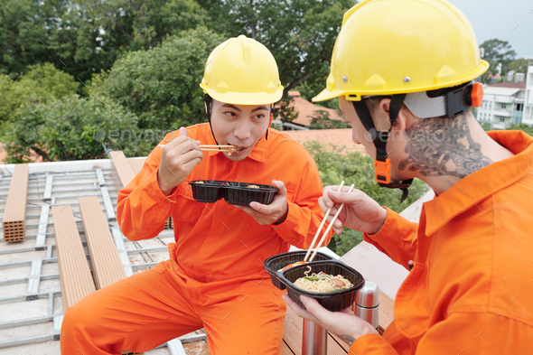 Builders Eating Lunch at Construction Site
