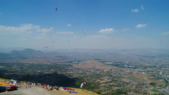 Paragliding Festival Crowds In City Landscape alt