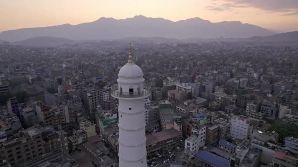Aerial view over Kathmandu flying around the Dharahara Tower alt