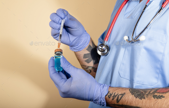 hand holding syringe with liquid vaccines, coronavirus flu prevention and treatment