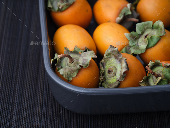 Persimmons in a tray