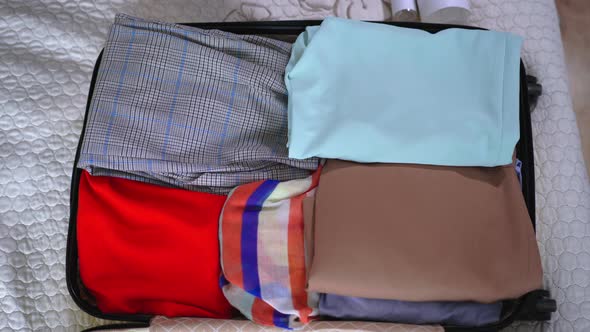 Ravel Pandemic, Female Preparing for Trip Puts Medical Mask and Gloves and Sanitizer or Antiseptic alt