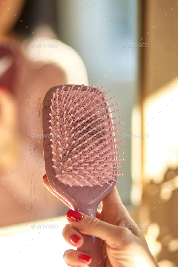 Problem hair loss concept, losing hair on hairbrush