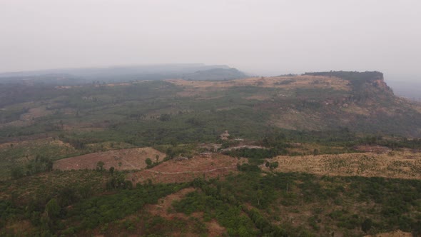 Drone Shot of Beautiful Skies and Wild Mountain Ranges Along Cambodia alt