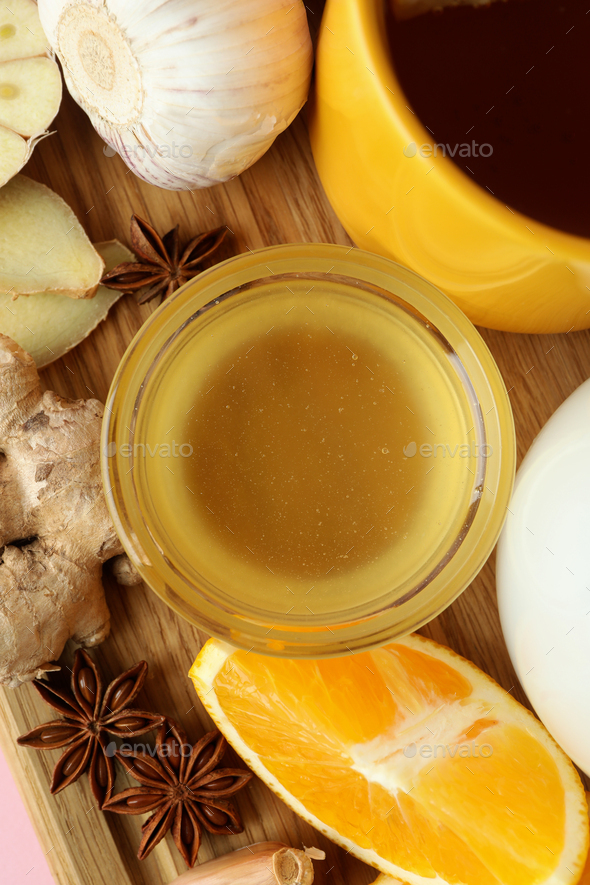 Concept of treatment colds with honey and garlic, close up Stock Photo