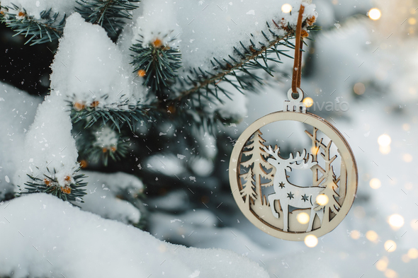 Christmas New Year Holiday Card. Pine tree with wooden toy and bokeh lights. - Stock Photo - Images