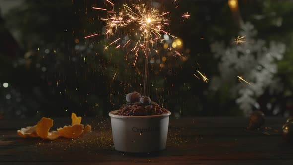 Christmas dessert with confetti and sparkler