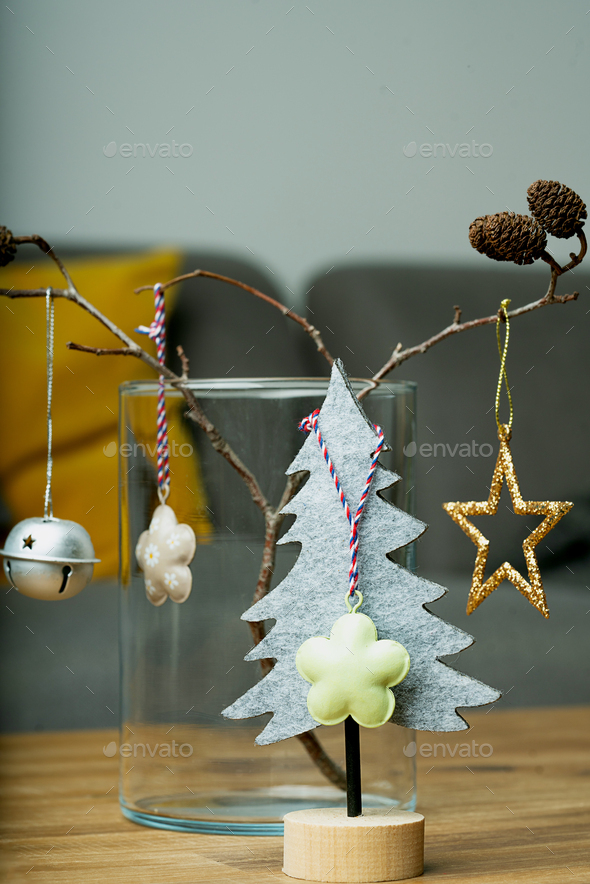 Felted Christmas trees in grey and yellow interior design - Stock Photo - Images