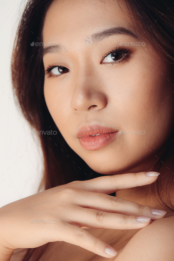 Portrait of naked young Chinese woman Stock Photo by ADDICTIVE_STOCK