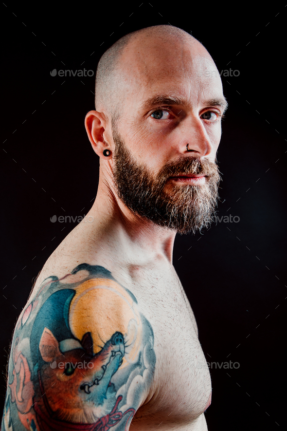 Young shirtless bearded guy with tattoos Stock Photo by ADDICTIVE_STOCK