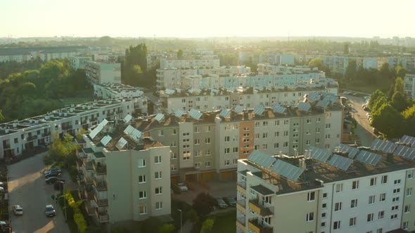 Drone Shot on Modern Multiapartment Buildings with Solar Panels on the Roofs alt