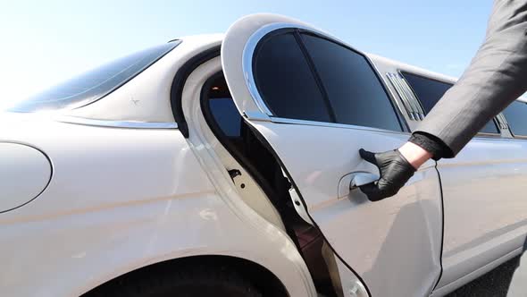 Your ride sir.  A limo door is opened in slow motion.  limousine driver awaits your entry.  White li alt