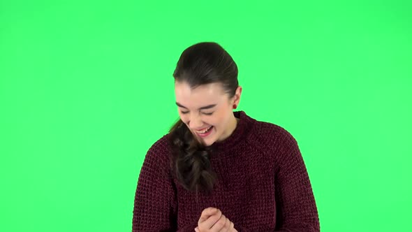 Girl Listens Carefully Then Bursts Into Laughter. Green Screen alt