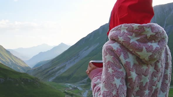 Person Drink Morning Coffee In Mountains