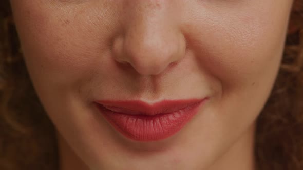 Woman Lips and Mouth in Motion with Red Lipstick alt