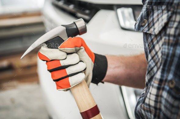 Large Hammer in Contractors Hand - Stock Photo - Images
