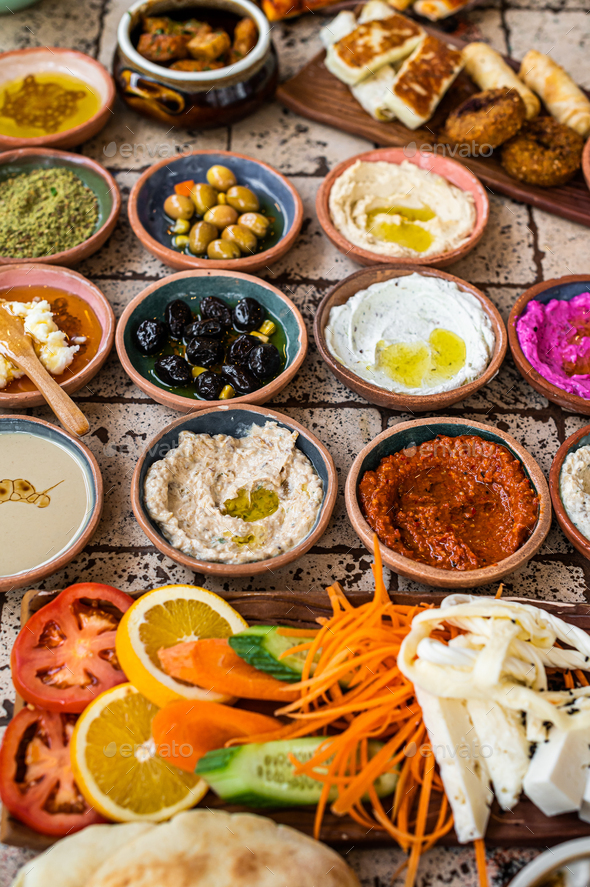 Turkish family breakfast table with pastries, vegetables, greens ...