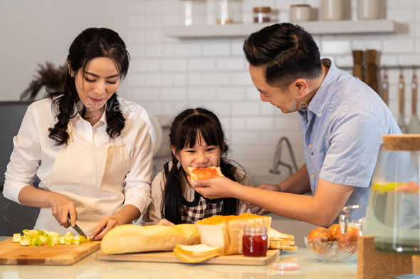 Family relationship, Asian happy family making food preparation in kitchen room at house.