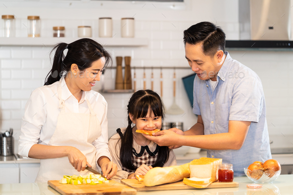 Family relationship, Asian happy family making food preparation in kitchen room at house.