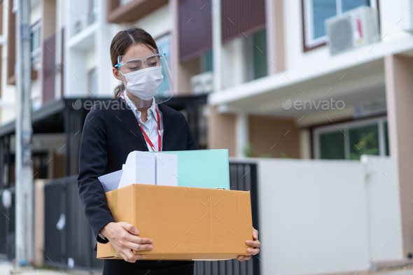 Asian business woman wear face mask after unemployment from company. - Stock Photo - Images