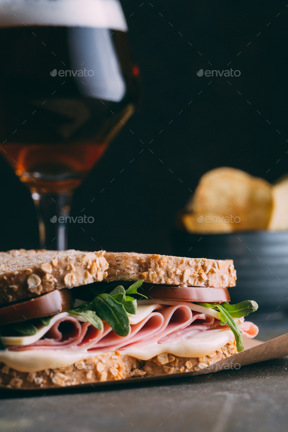 Delicious sandwich with ham, cheese, lettuce and tomato
